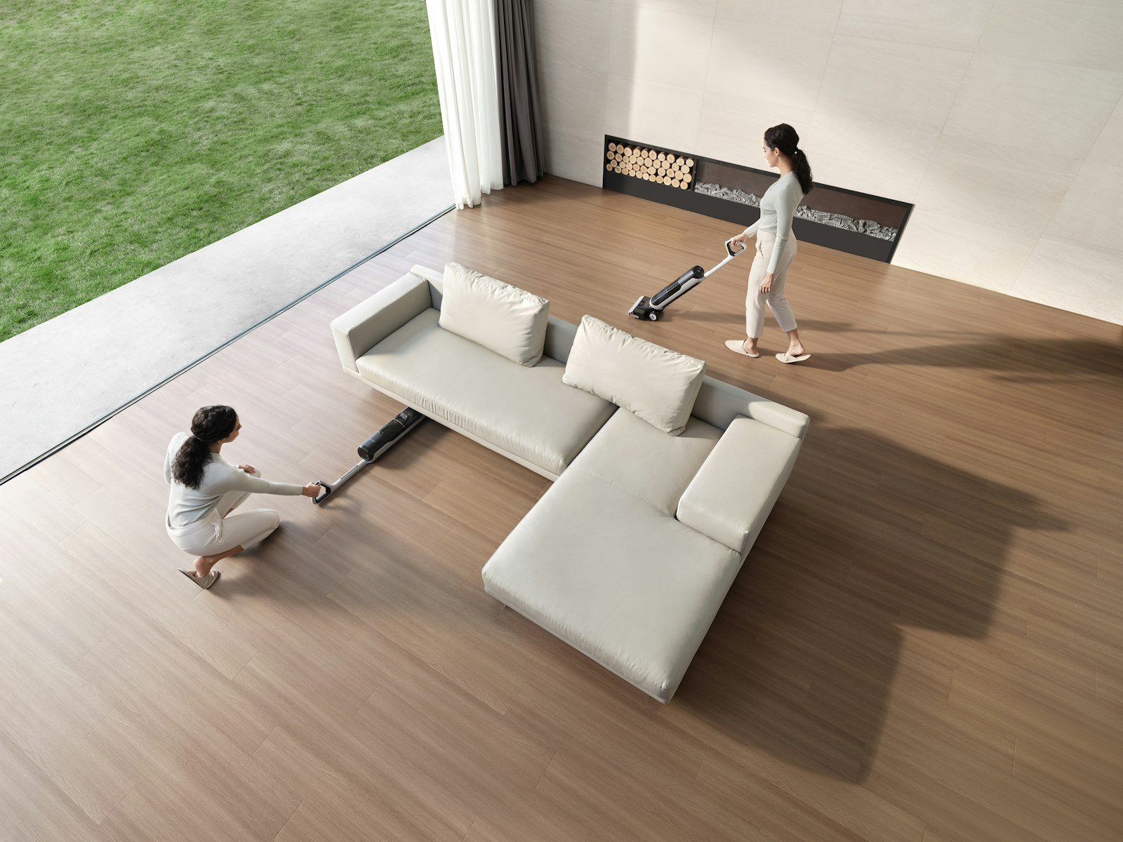 Two people cleaning a modern living room
